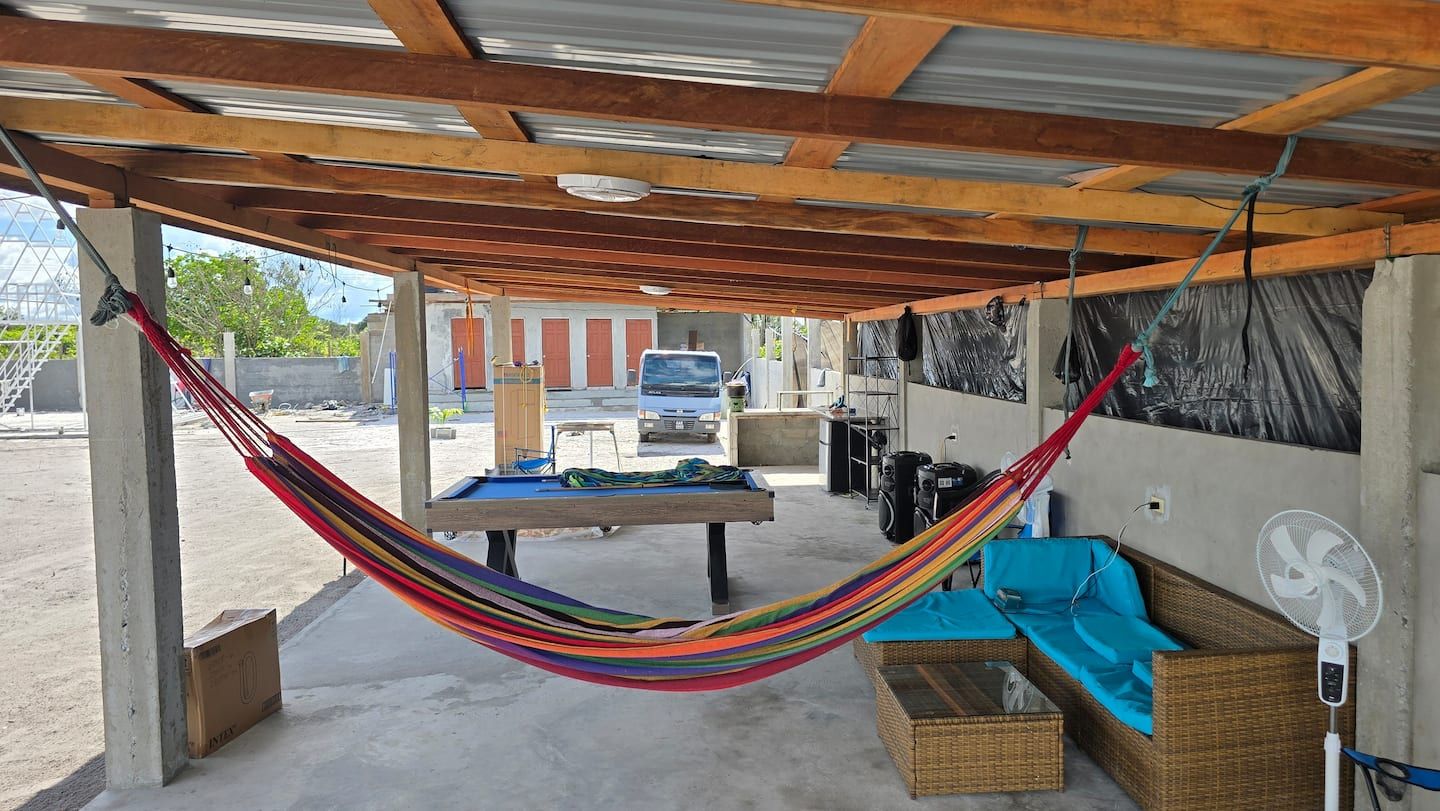 The 50-foot shed with a hammock, pool table and sofas